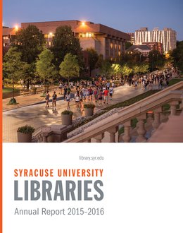 Bird Library lit up at dusk with front walkway crowded with students