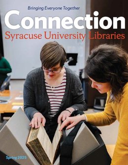 two people looking at book in special collections